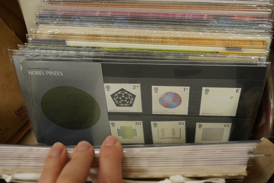 A collection of Royal Mail QEII first day covers and mint presentation packs and various loose stamps